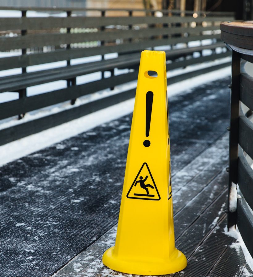 Be aware of slippery road. Slippery yellow surface sign. Wet floor sign. Icing concept