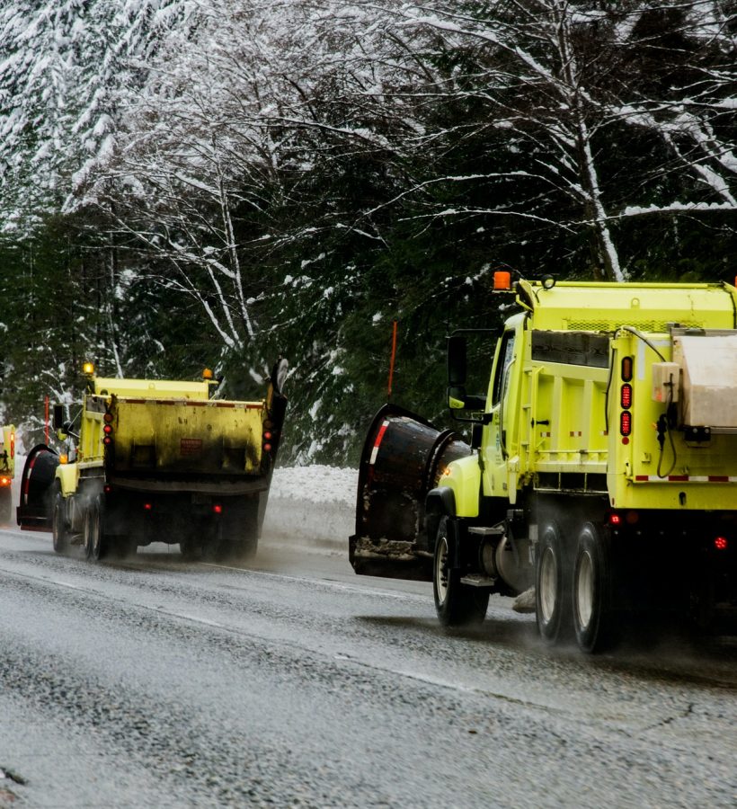 Snow plows clearing winter roads