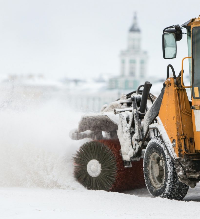 Snowplow truck vehicle removing snow after blizzard/snowstorm